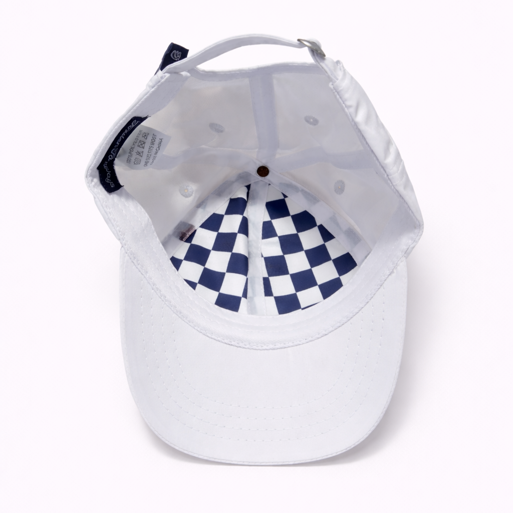 White baseball cap with blue and white checkered interior on a white background