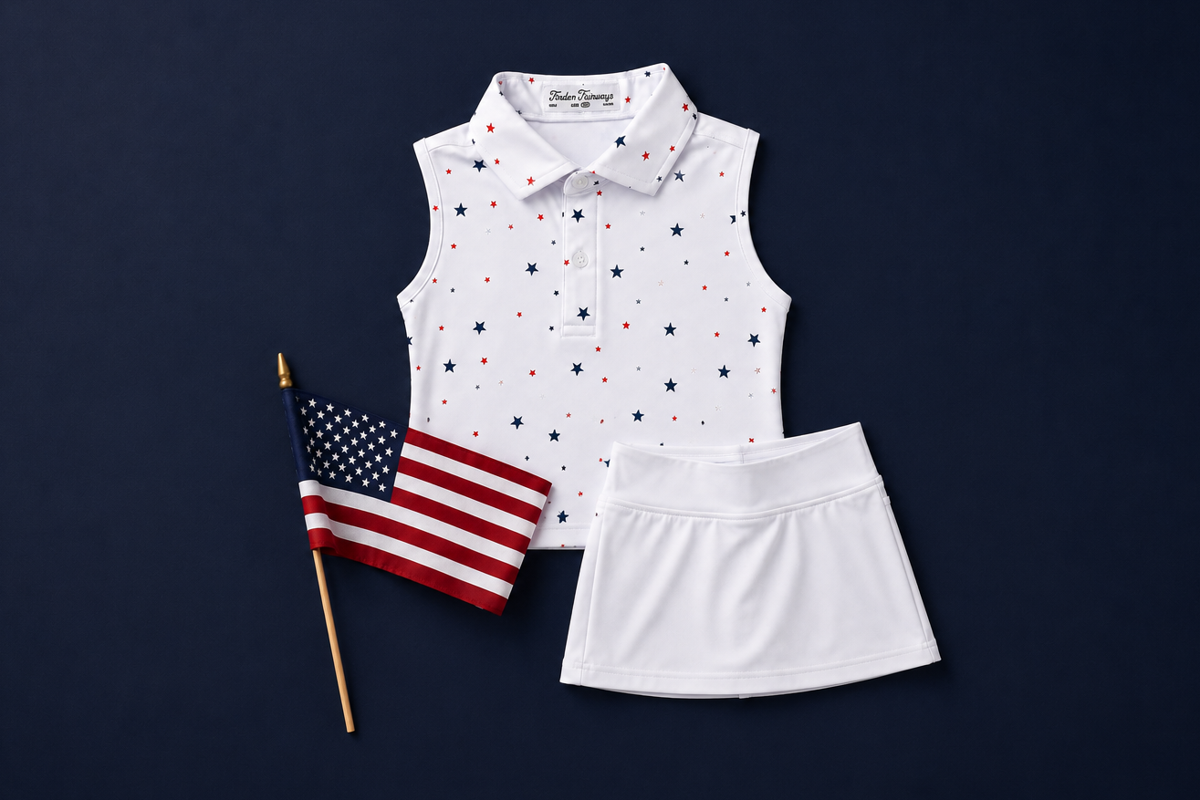 White sleeveless top with red and blue polka dots and white skirt on a dark background with an American flag.